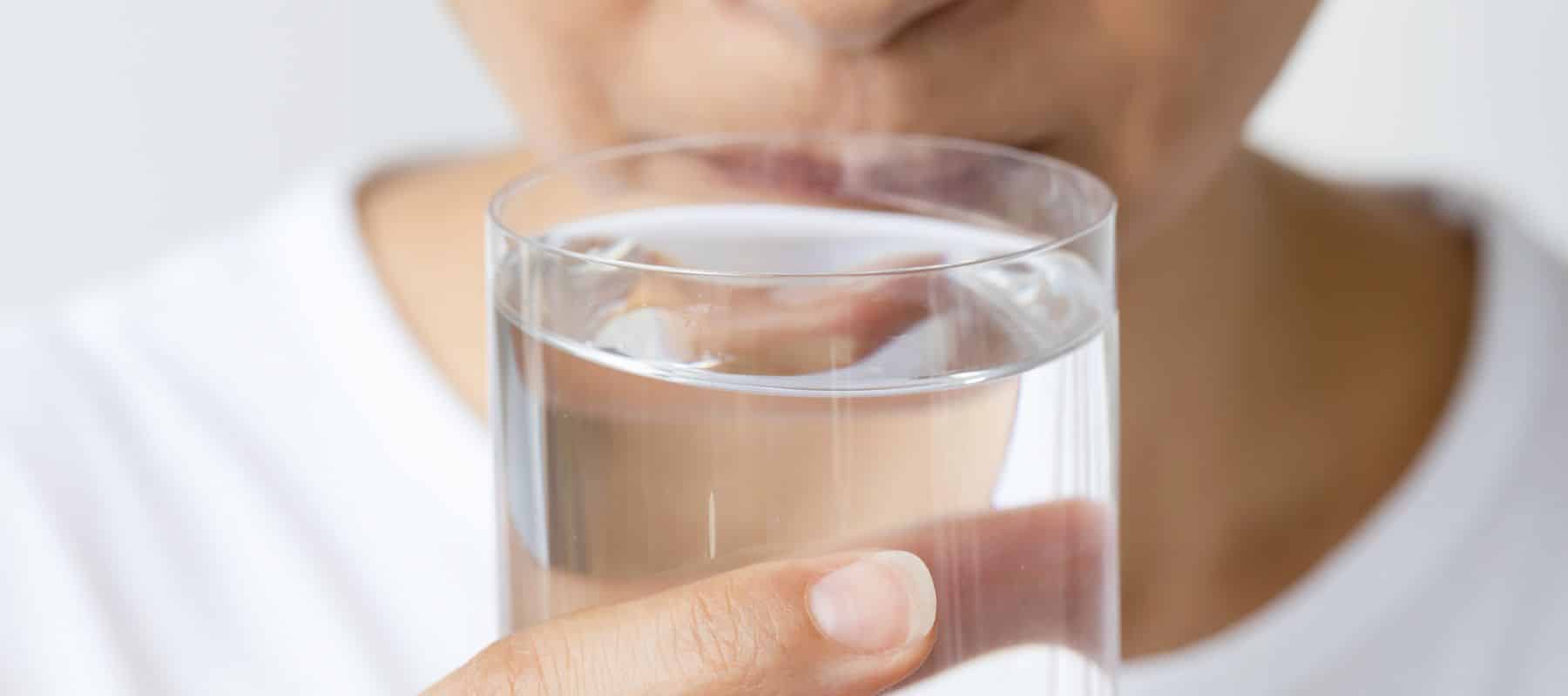 woman noticing bad smell on water