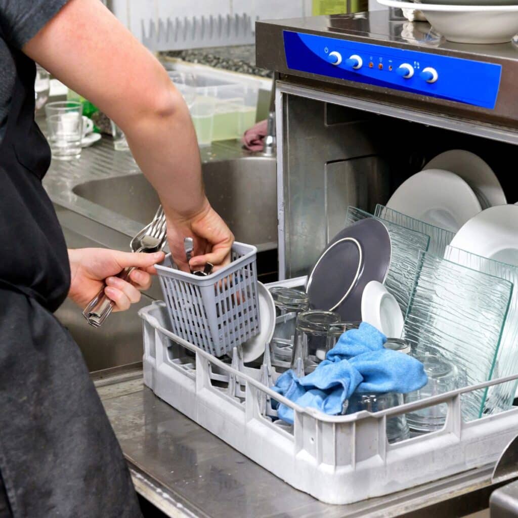 dishwasher that is being loaded for cleaning